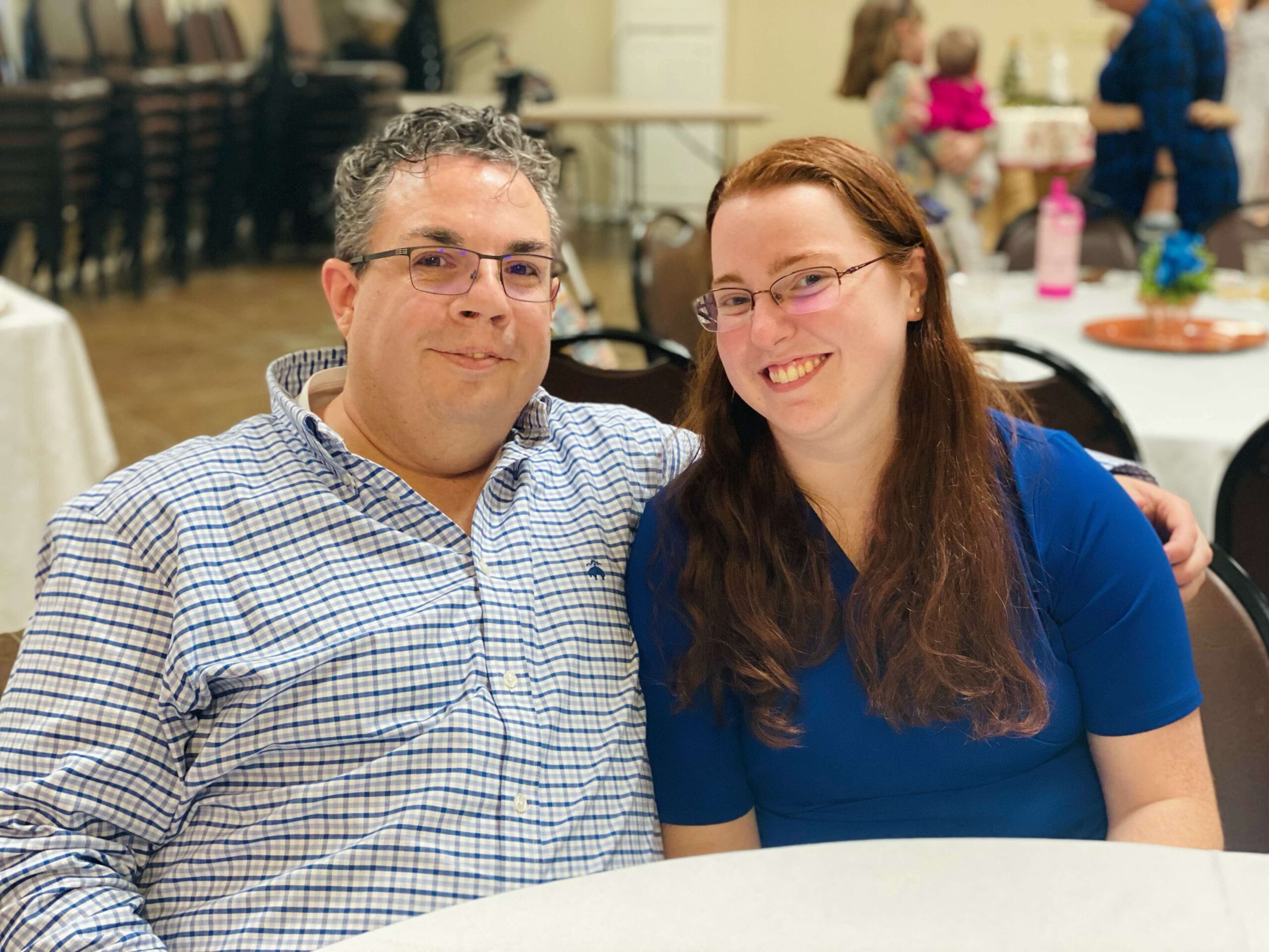 Jason and Rosie sitting at a table